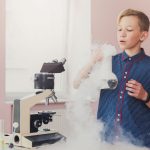 child conducting a science experiment